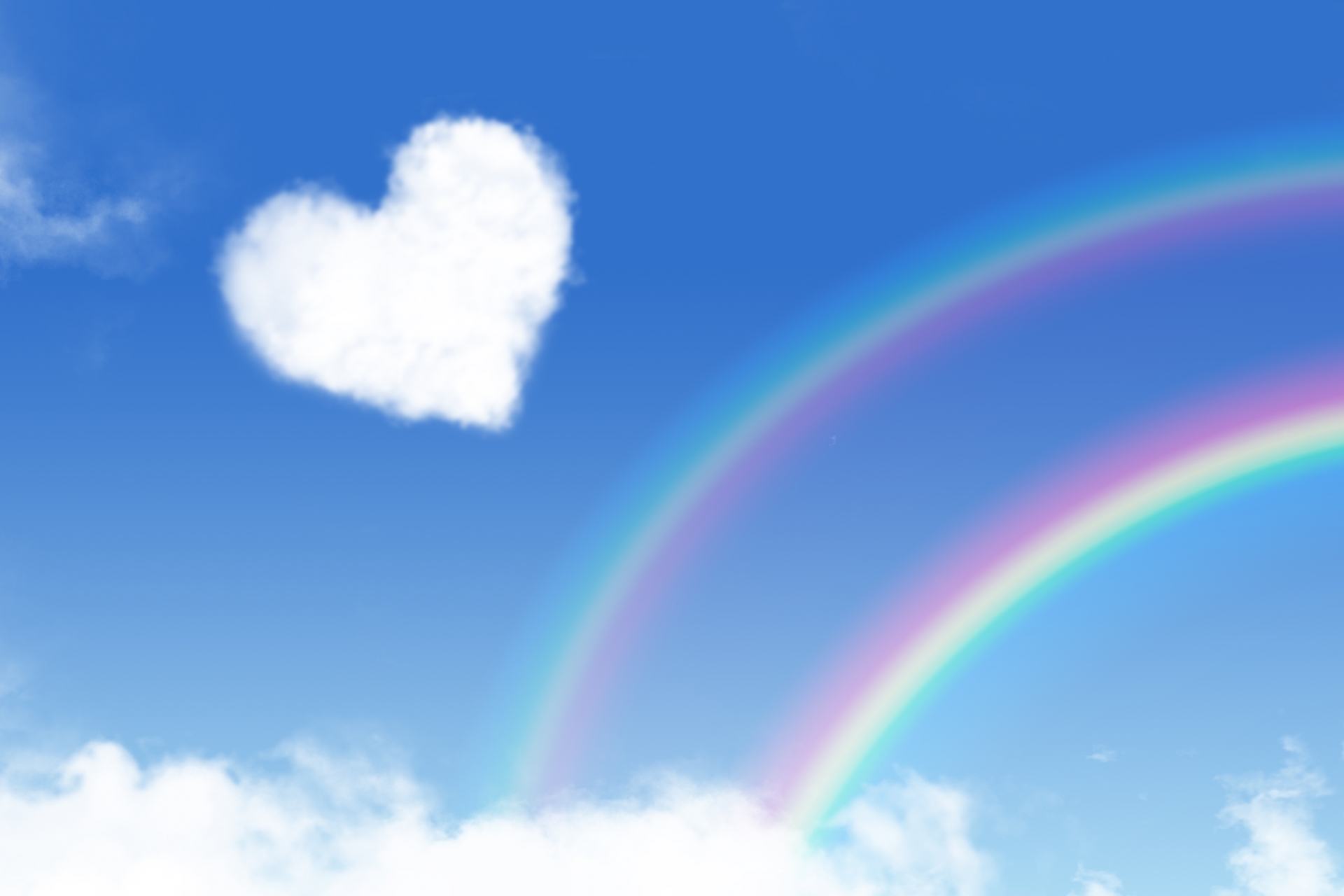 ハートの雲と虹の画像